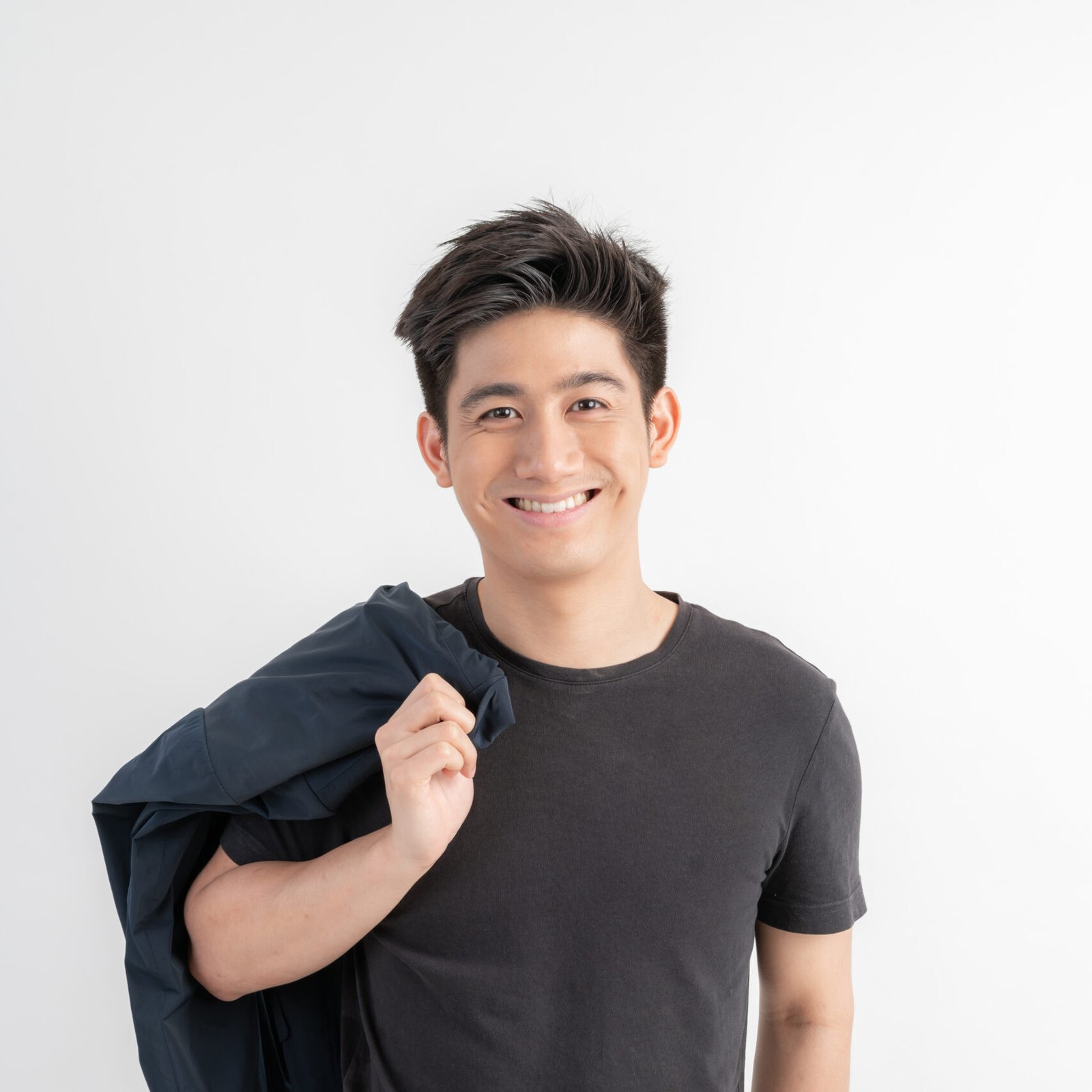 Portrait smiling handsome Asian man , good looking asian man over gray background